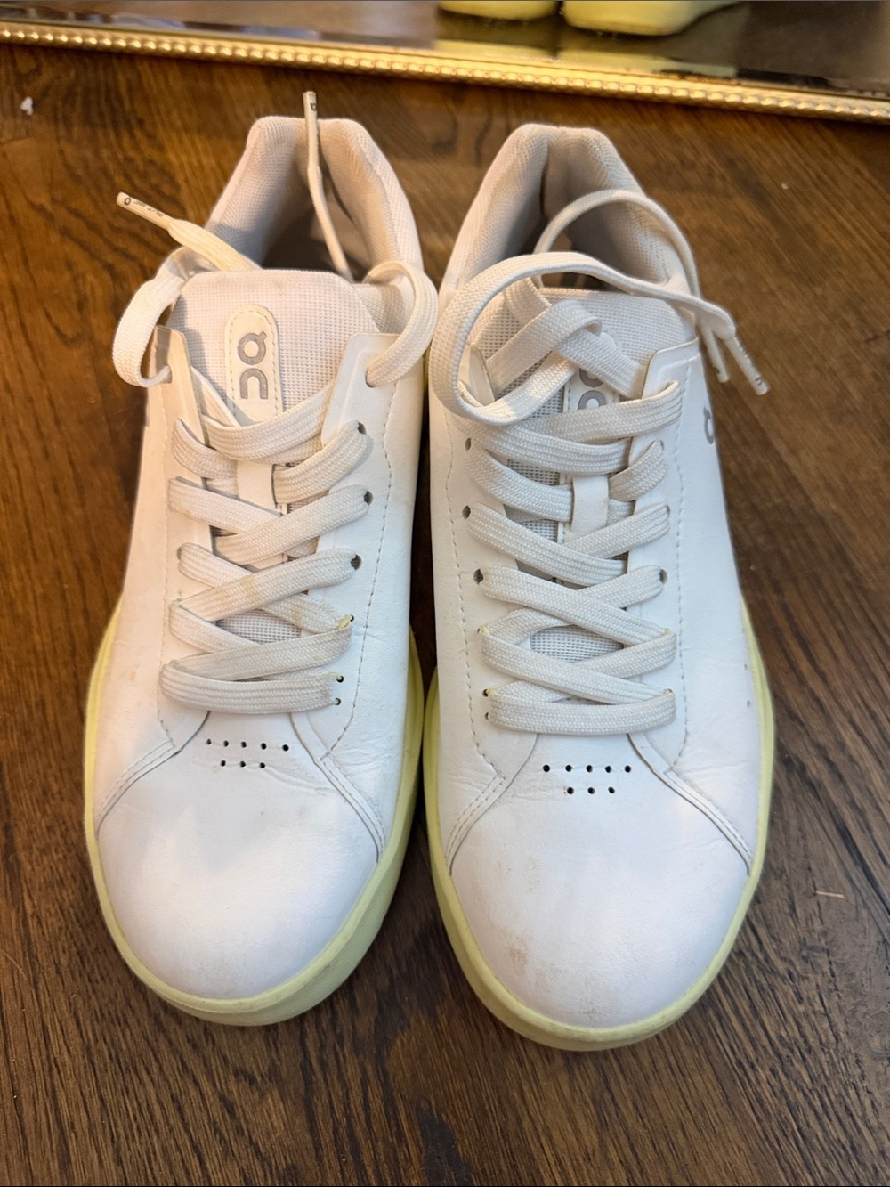 On Running women’s White Sneakers with Pale Yellow Sole
